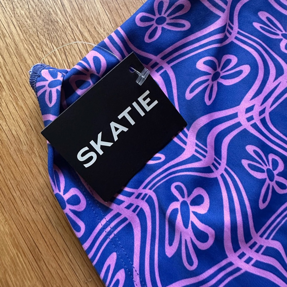 NWT Skatie Vibrant Blue and Pink bikini top with sleeves